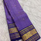 Lavender Oodha Pure Kanchipuram Silk Zari Kattam saree with royal blue border worn at an Andal Thirukalyanam celebration