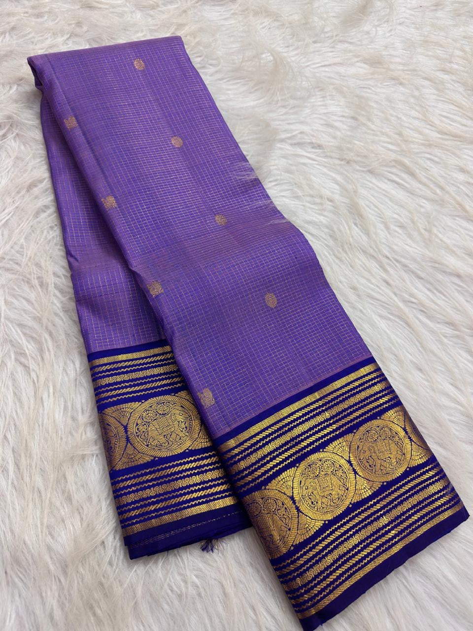 Lavender Oodha Pure Kanchipuram Silk Zari Kattam saree with royal blue border worn at an Andal Thirukalyanam celebration