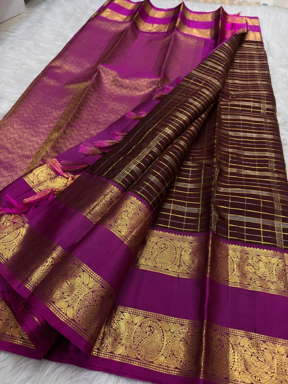 Oodha magenta Kanchipuram Zari Kattam silk saree with Kamalam lotus buttas at a bridal family dinner
