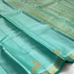 Sea glass turquoise Kanchipuram silk body with delicate handwoven zari peacock motifs spaced across fabric