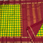 Close view of the red Rettapet border and gold zari on handwoven Kanchipuram pure silk