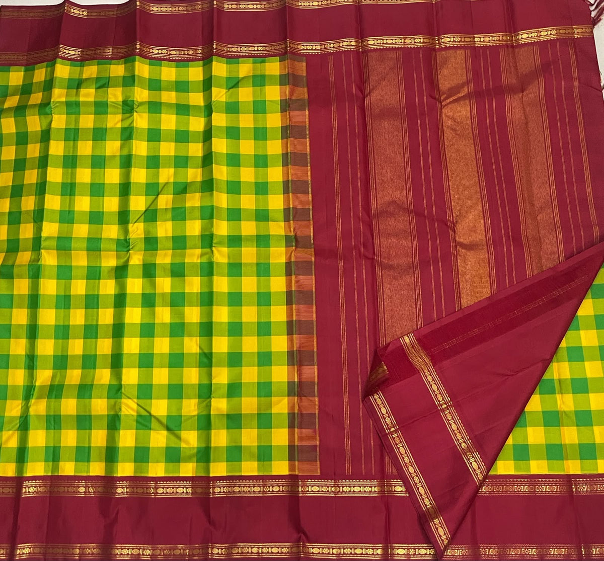 Close view of the red Rettapet border and gold zari on handwoven Kanchipuram pure silk