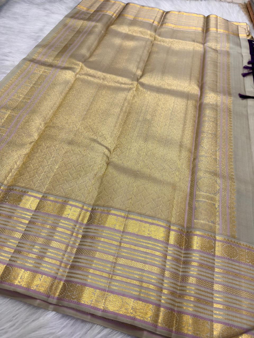 Deep purple Varisaipet Kanchipuram silk saree body with small zari buttas.