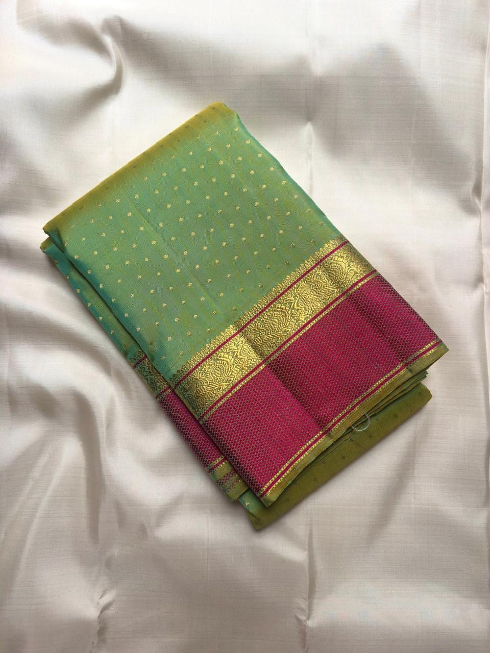 Thulir Pachai and Raspberry Pink Handwoven Pure Silk Kanchipuram Pattupet Saree, peacock array in decorative border
