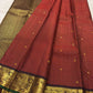 Vermilion red handwoven pure silk Kanchipuram Zari Kattam saree with fine gold zari grid and spaced gold buttas, full view