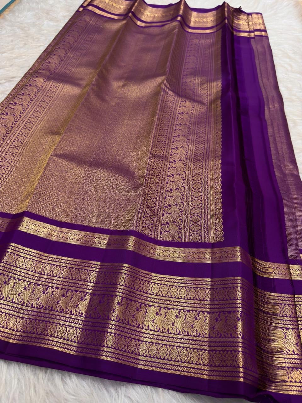 Royal oodha purple and deep aubergine Kanchipuram zari kattam silk sarees, showing body, border and detailed gold zari pallu