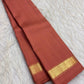 Muted Arakku rose Pure Kanchipuram Silk saree with terracotta pink undertones and slender gold-toned zari border