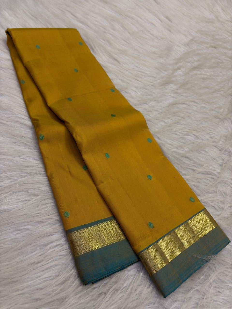 Turmeric Yellow and Peacock Blue Simple Kanchipuram silk saree, detail view