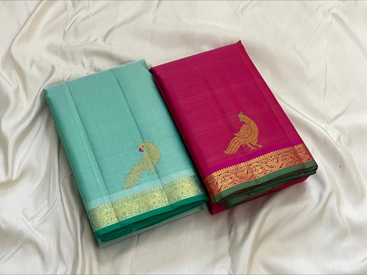 Full view of seafoam turquoise Vairaoosi Kanchipuram pure silk saree with gold zari peacock buttas