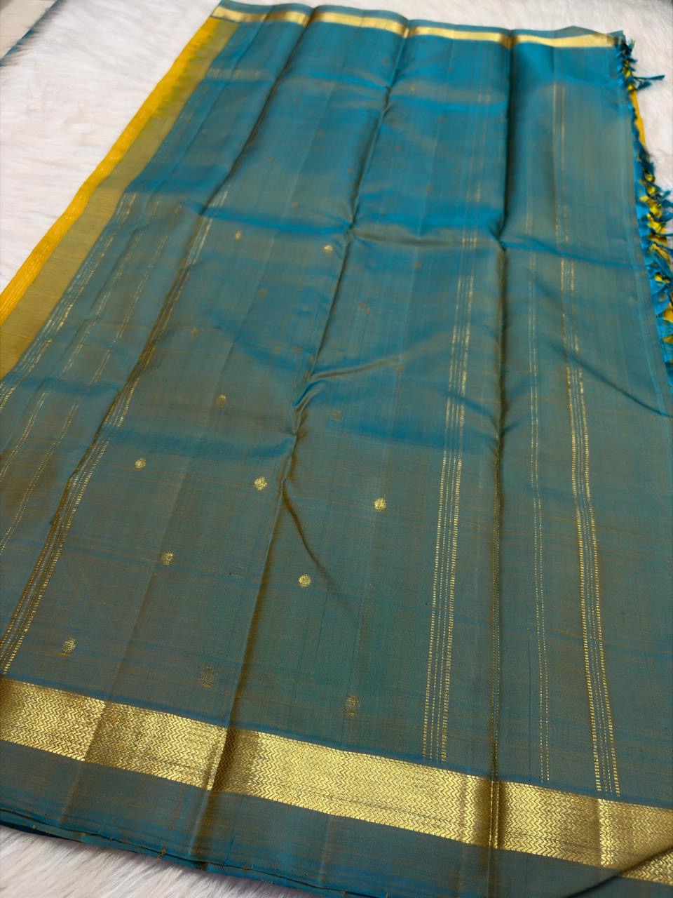 Turmeric Yellow and Peacock Blue Simple Kanchipuram silk saree, close view
