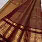 Warm arakku red Kanchipuram zari kattam saree, showing body, border and detailed gold zari pallu