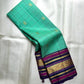 Kanchipuram silk saree sea aqua tone with grid design and plum zari border pallu detail