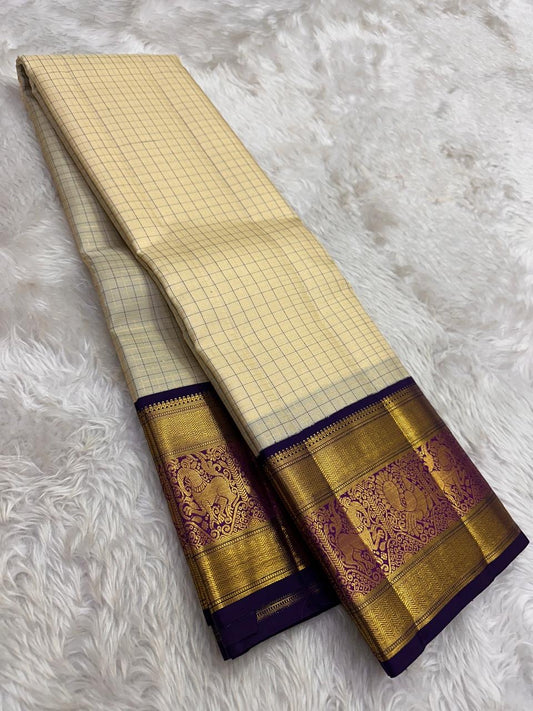 Beige Kanjivaram saree with purple zari kattam check pattern detail close up