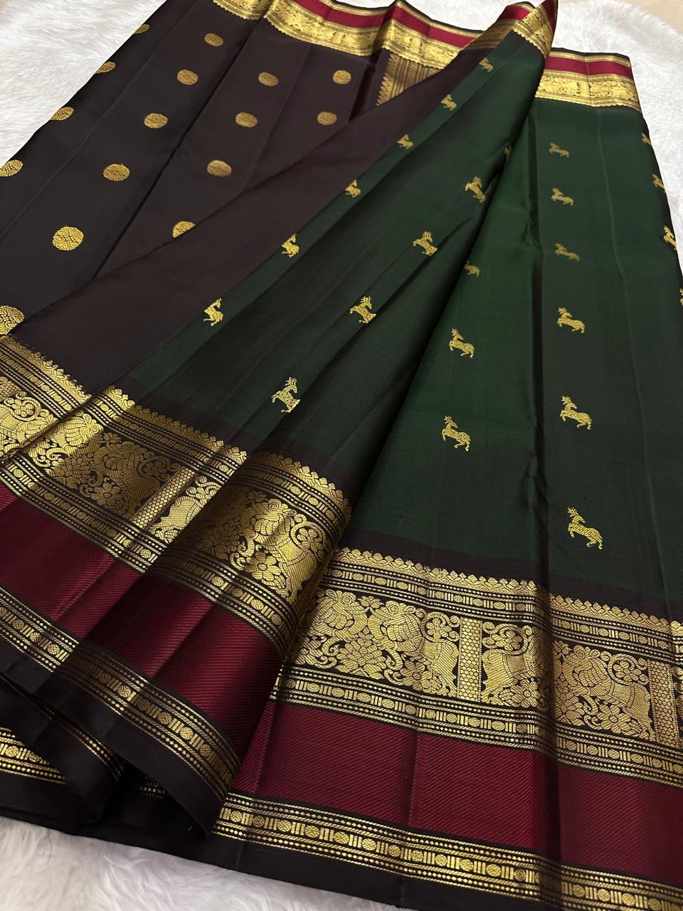 Kancheepuram silk saree green body red border pallu detail traditional zari