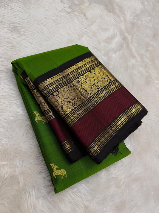 Leafy green Kanchipuram silk saree with burgundy red border folded view