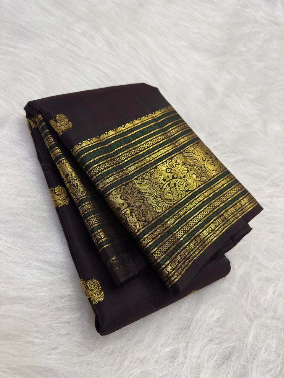 Coffee brown pure silk Kanchipuram saree with antique gold mayil chakram buttas, deep green accents, and a detailed peacock and arai maadam pallu, view 2.