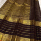 Brown pure silk Kanchipuram saree, silk texture close up with kaapi brown with deep aubergine undertones and kesari-orange selvedge