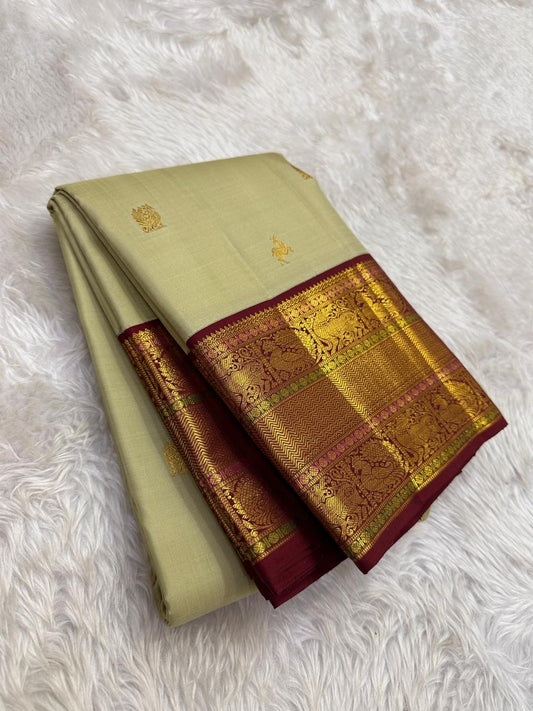 sage green kanchipuram silk saree with crimson red border antique gold zari full view