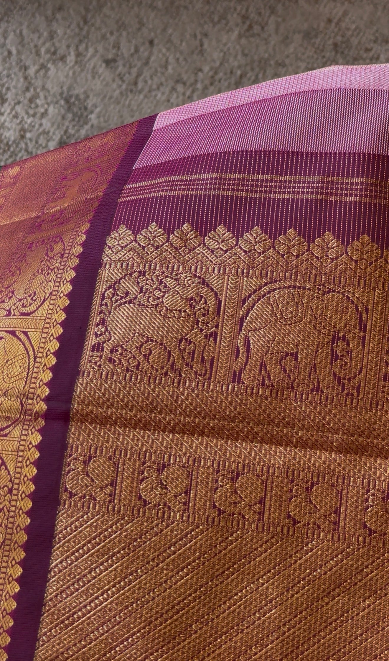 Elegant pastel Kanchipattu saree pallu detail with traditional zari lines in vairaoosi weave