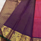 Close view of gold zari kattam checks and petite floral buttas on raspberry red pure silk Kanchipuram saree body