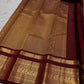 Warm arakku red Kanchipuram zari kattam saree, showing body, border and detailed gold zari pallu