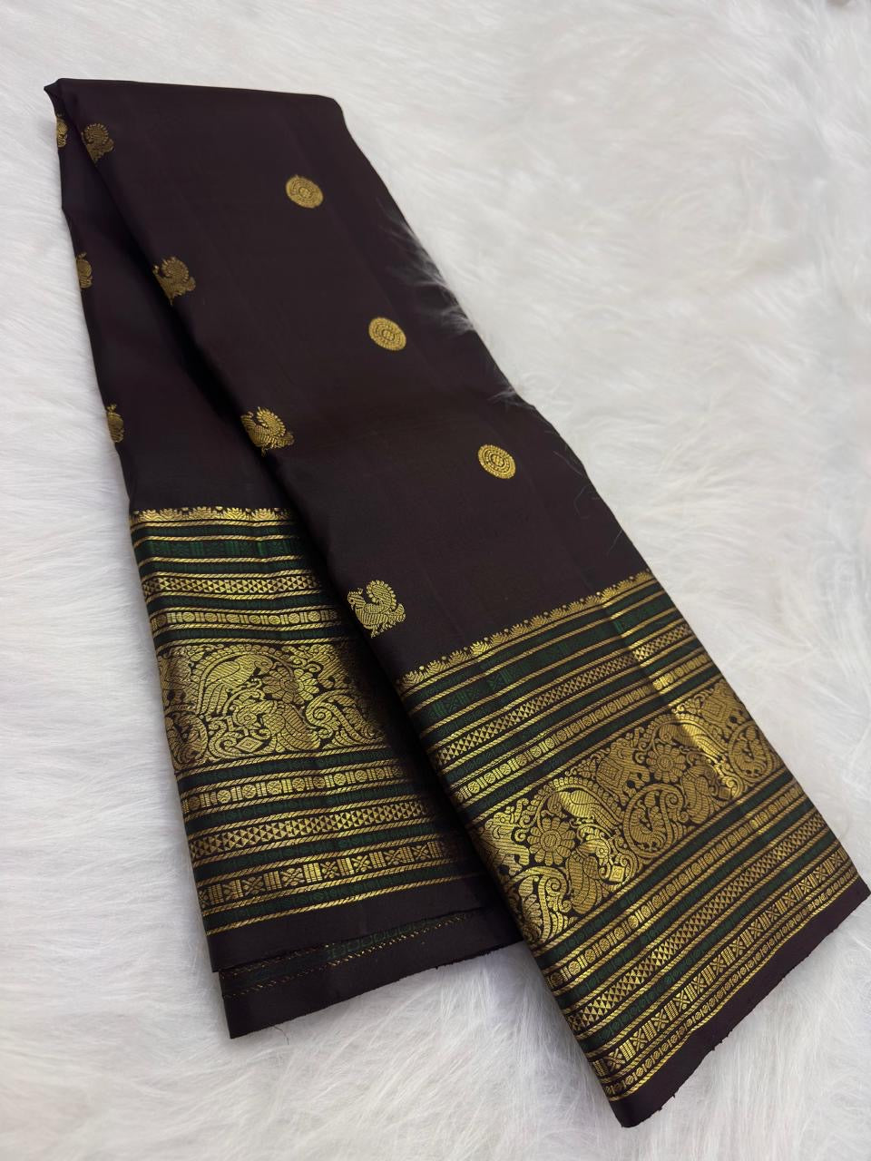 Coffee brown pure silk Kanchipuram saree with antique gold mayil chakram buttas, deep green accents, and a detailed peacock and arai maadam pallu, view 4.