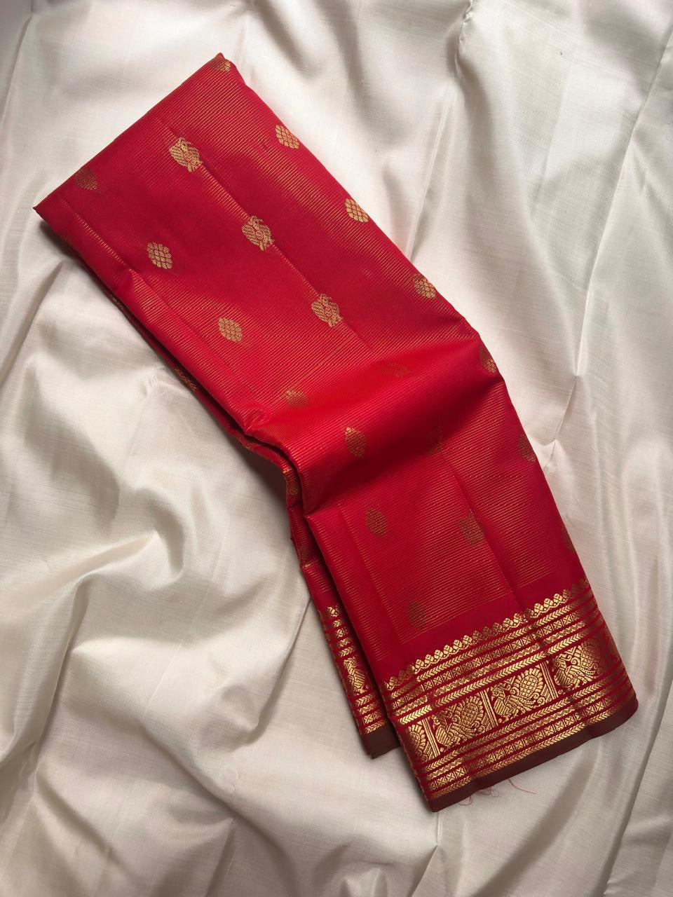 Arakku Red Pure Kanchipuram Silk Vairaoosi saree with fine zari lines, gold motifs and traditional peacock border