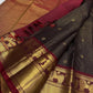 Deep brown Arakku red Vairaoosi Kanchipuram silk saree with gold geometric pallu at a temple Sudarshana homam