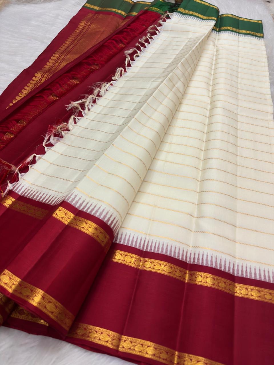 Ivory Veldhari Korvai Kanjivaram silk saree with contrasting Ganga Jamuna border, worn for a Sudarshana Homam.