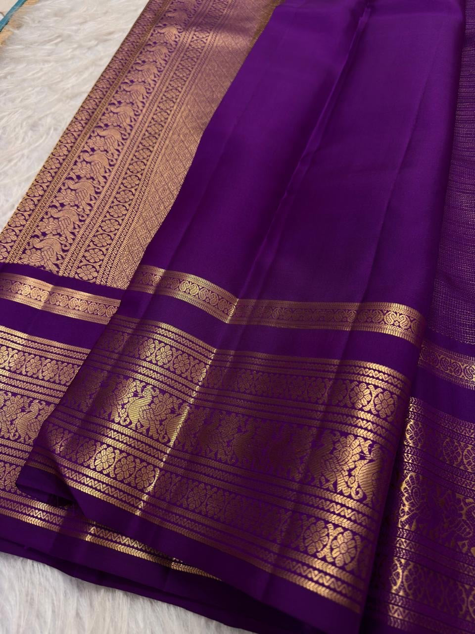 Royal oodha purple and deep aubergine Kanchipuram zari kattam silk sarees, showing body, border and detailed gold zari pallu