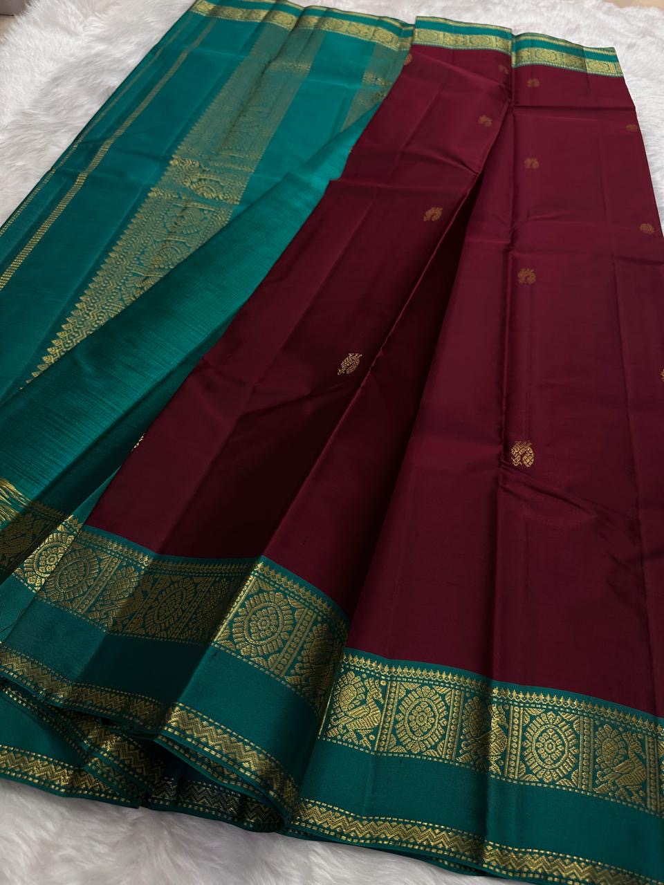 Lightweight Kanchipuram saree with peacock teal contrast border