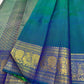 Peacock Blue, emerald green, royal blue and antique gold handwoven Kanchipuram butta silk saree, body silk detail, with gold zari detailing.