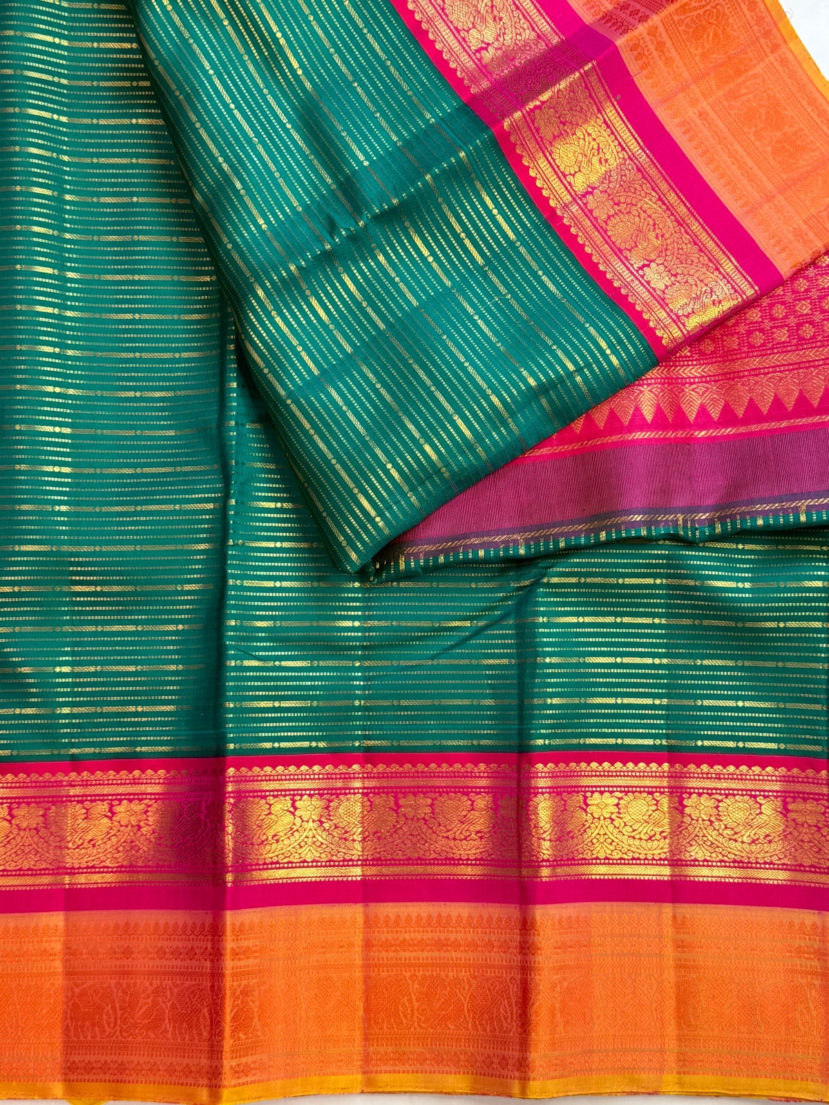Peacock teal Korvai pure silk Kanchipuram saree with thick Veldhari body, double Korvai border and sunset-orange grid pallu, Idam Living (photo 3 of 5)