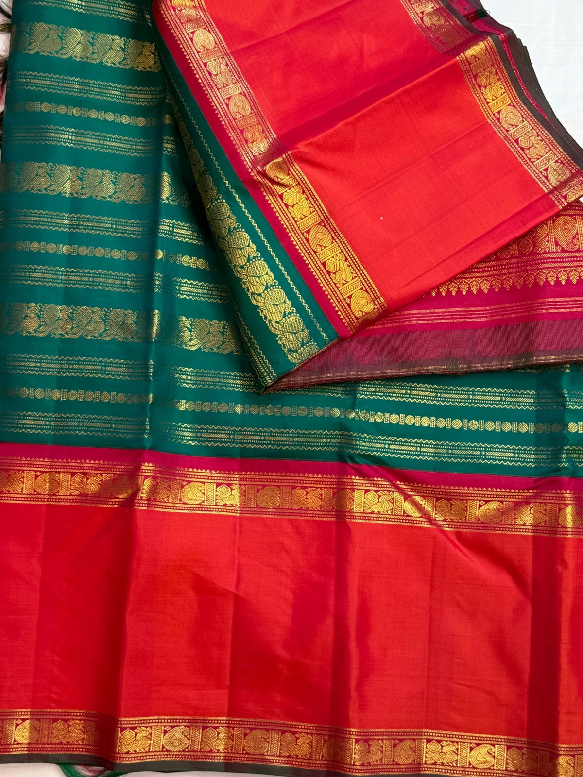 Pallu detail of a peacock-green Rettapet Kanchipuram silk saree, Idam Living (photo 3 of 8)