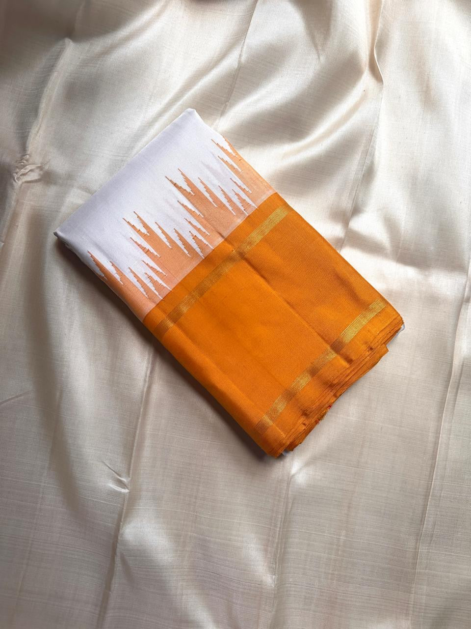 White and orange handwoven pure silk Kanchipuram Korvai saree — overview of the full saree drape