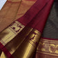Deep brown Arakku red Vairaoosi Kanchipuram silk saree with yazhi motif border at a temple laksharchana puja