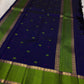 Karu Neelam pure silk Kanchipuram Butta saree with green silk-thread motifs and vivid Ilai Pachai zari border.
