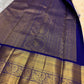 Deep Karu Neelam border with Mayil and Annam-style bird motifs woven in luminous classic gold zari.