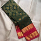 Deep forest-green Kanchipuram silk richly woven with curling floral and leafy classic gold zari brocade.