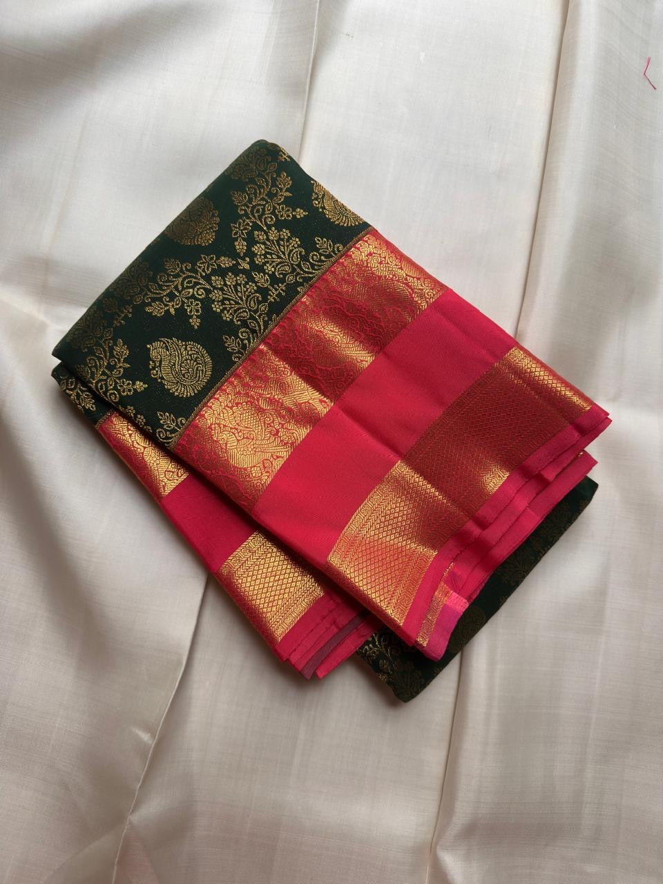 Karum Pachai pure silk Kanchipuram Rettapet saree with vivid Rani Pink and classic gold zari border.