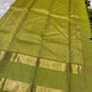 Karum Pachai pure silk Kanchipuram Rettapet saree with silver-toned maanga buttas and Kili Pachai zari border.