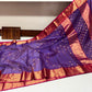 Close view of the ornate gold woven border on the Royal Purple Katan Silk Chanderi saree.