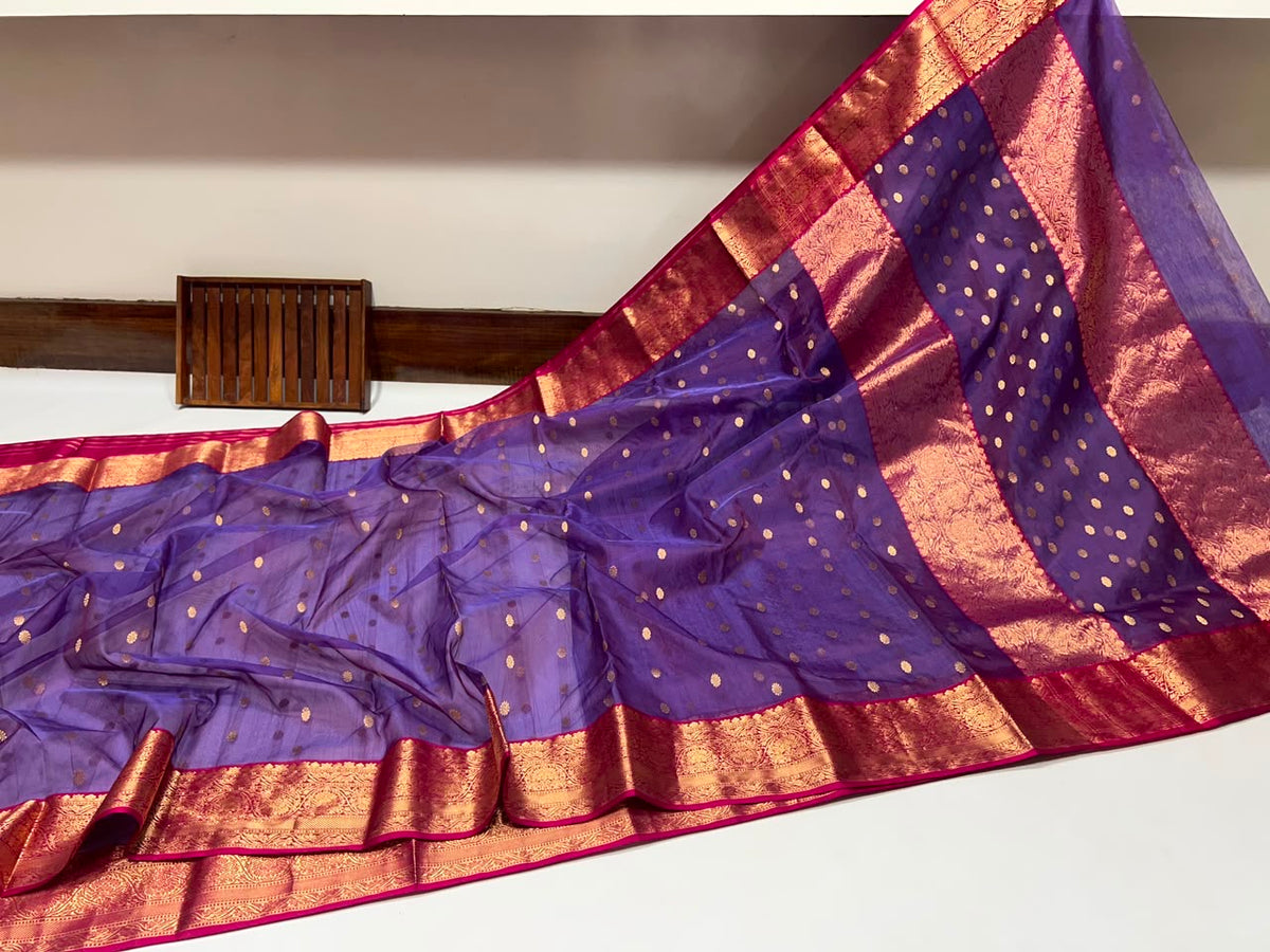 Close view of the ornate gold woven border on the Royal Purple Katan Silk Chanderi saree.