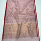 Detail of the striped gold-toned zari pallu on the Dusty Rose Chanderi saree