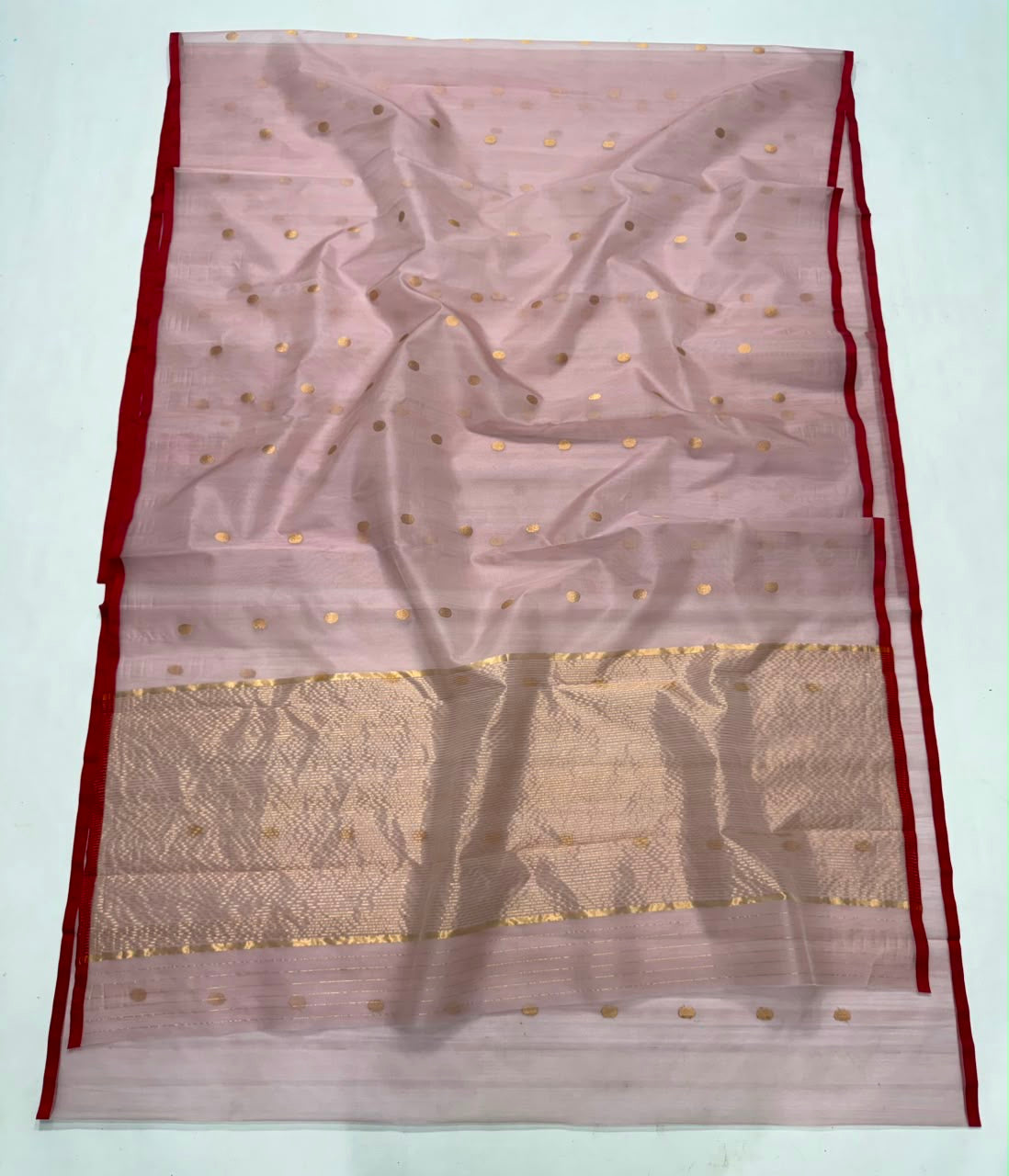 Detail of the striped gold-toned zari pallu on the Dusty Rose Chanderi saree