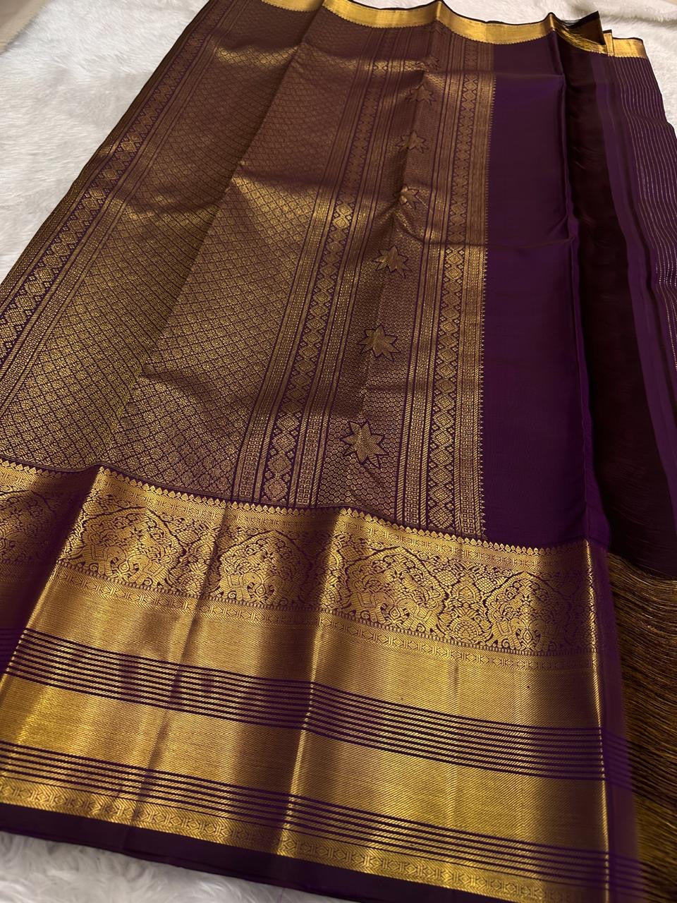 Kathiri Purple Pure Silk Kanchipuram Butta saree with deep aubergine tone.