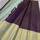 Deep aubergine-plum Kanchipuram silk body crossed with delicate fine classic-gold Zari Kattam lines.