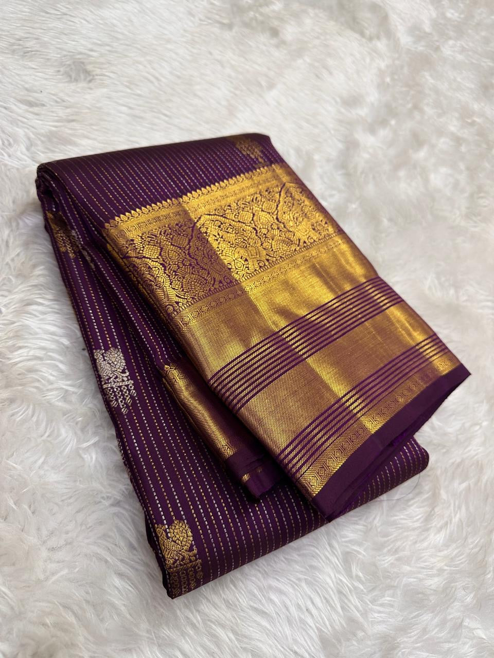 Kathiri Purple Kanchipuram Butta saree with broad classic-gold zari border.