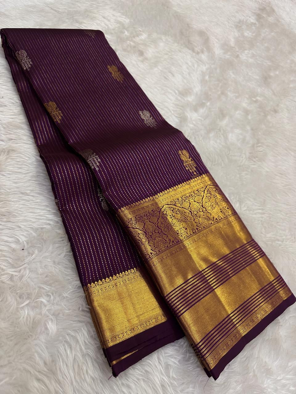 Vairaoosi-style zari lines and buttas on the Kathiri Purple Kanchipuram silk.