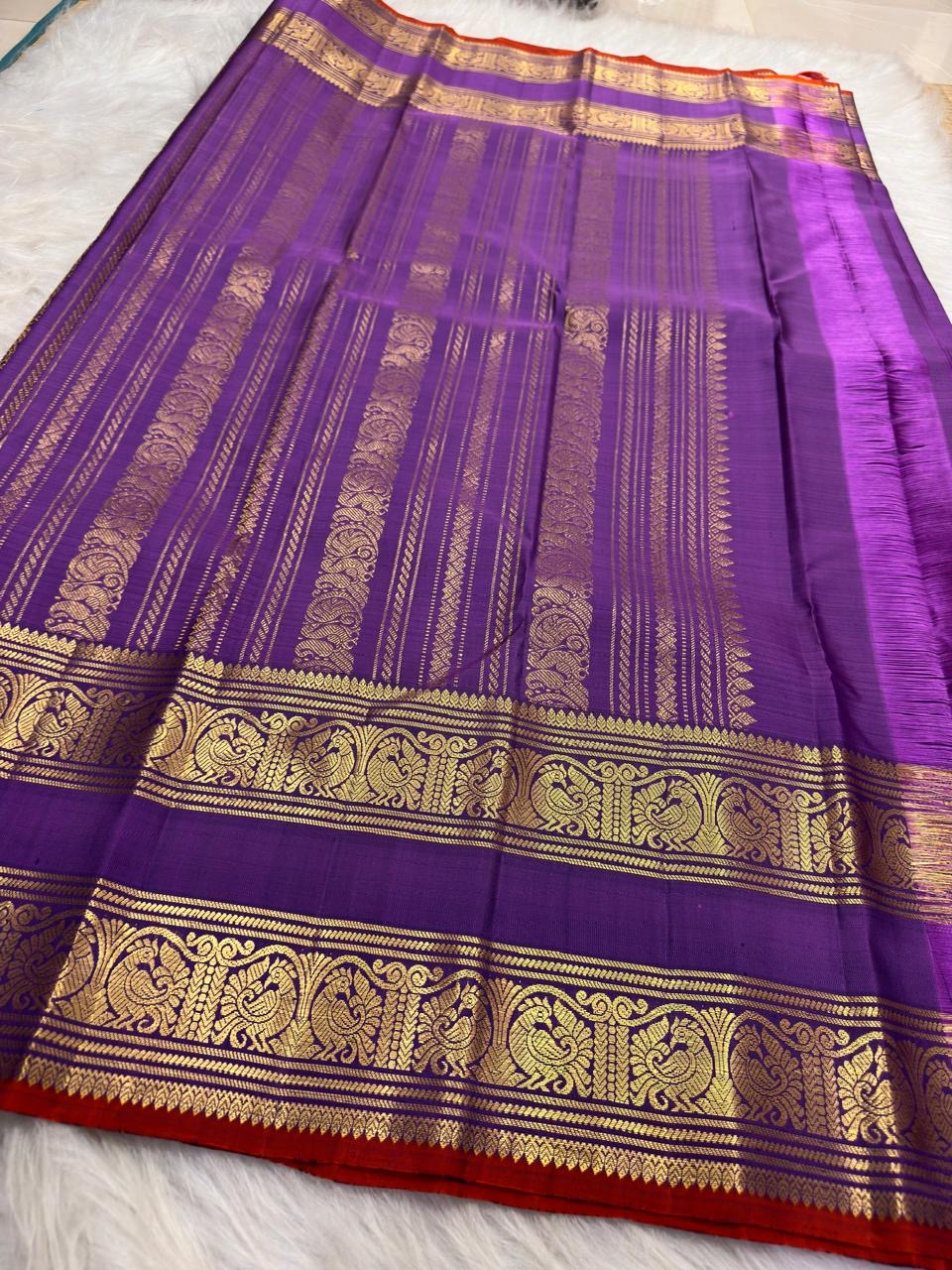 Kathiripoo Violet Handwoven Pure Silk Kanchipuram Saree with Rettapet Mayil Zari Border and Orange-Red Selvedge